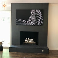 a fireplace with a tv mounted on it