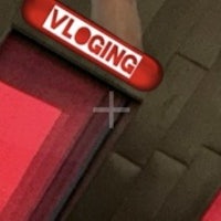 a red button with the word vlogging on it