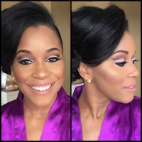 a woman in a purple robe with makeup on her face