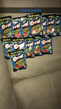 a pack of gummy bears sitting on a couch