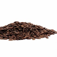 a pile of flax seeds on a white background