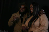 a man and woman standing next to each other