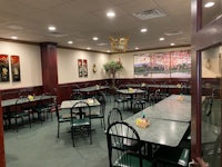 an empty restaurant with tables and chairs