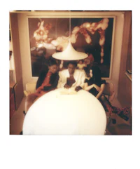 three people sitting around a table