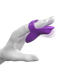 a woman's hand is holding a purple finger ring