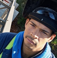 a man wearing a helmet on a construction site
