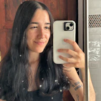 a woman taking a selfie in a mirror