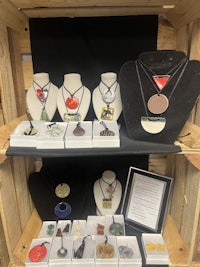 a display of necklaces in a crate