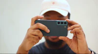 a man is taking a picture with his phone