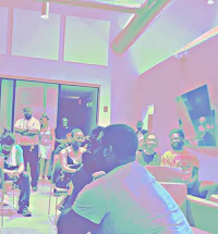 a group of people sitting in a room