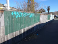 a fence with graffiti on it