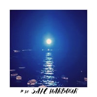 a photo of a boat in the water with the words sac harbour