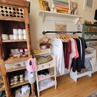 a store with clothes and other items on display