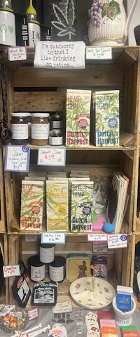 a display of various items on a wooden shelf