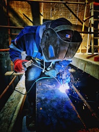 a welder working on a piece of metal