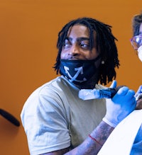 a man wearing a mask and a woman wearing a mask