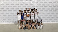 GP Gilas Boys after their basketball game, posed all together in red jerseys