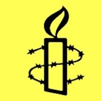 a candle with barbed wire on a yellow background