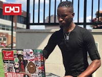 a young man with a laptop in front of him