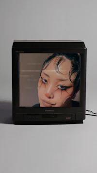 a television with a woman's face on it