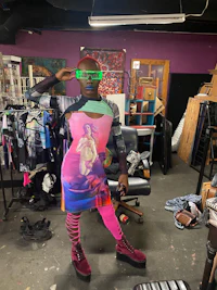 a woman wearing a dress with a picture of a woman on it