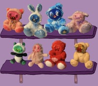 a group of stuffed animals on a shelf