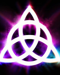 a purple trinity symbol on a black background