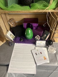 a box filled with items and a purple tulle