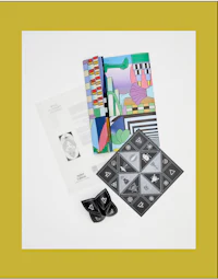 a set of books and other items on a white background