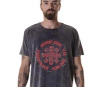a man with tattoos and a beard wearing a grey t - shirt