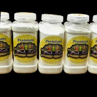 six jars of premium salt on a black background
