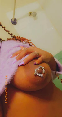 a woman with a piercing on her thigh