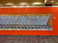 a painting of shopping carts on a wall