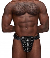 a man wearing a black leather thong with spikes