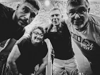 black and white photo of a group of people posing for a photo