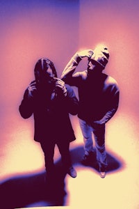 two people standing in a room