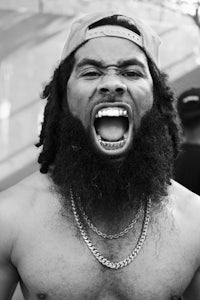 a black and white photo of a man with a beard
