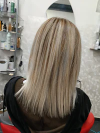 the back of a woman's hair in a salon