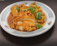 a plate of fried chicken on a table