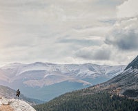 a man standing on top of a rocky mountain