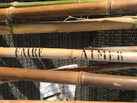 a group of bamboo sticks with words written on them