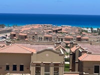 a view of a residential area with a view of the ocean