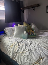 a bed in a room with a bedside table