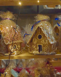 a display of gingerbread houses on a shelf