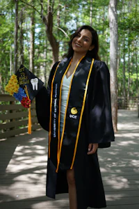 a woman wearing a graduation gown