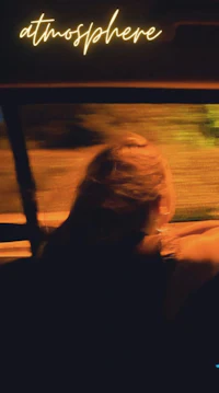 a woman in a car with the words'atmosphere'written on it