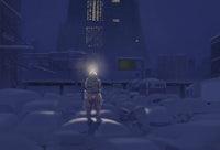 a man walking through a city at night with a flashlight