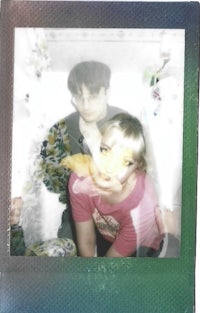 a polaroid photo of a man and a woman
