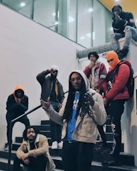 a group of people standing on some stairs