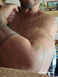 a man with a tattoo on his back